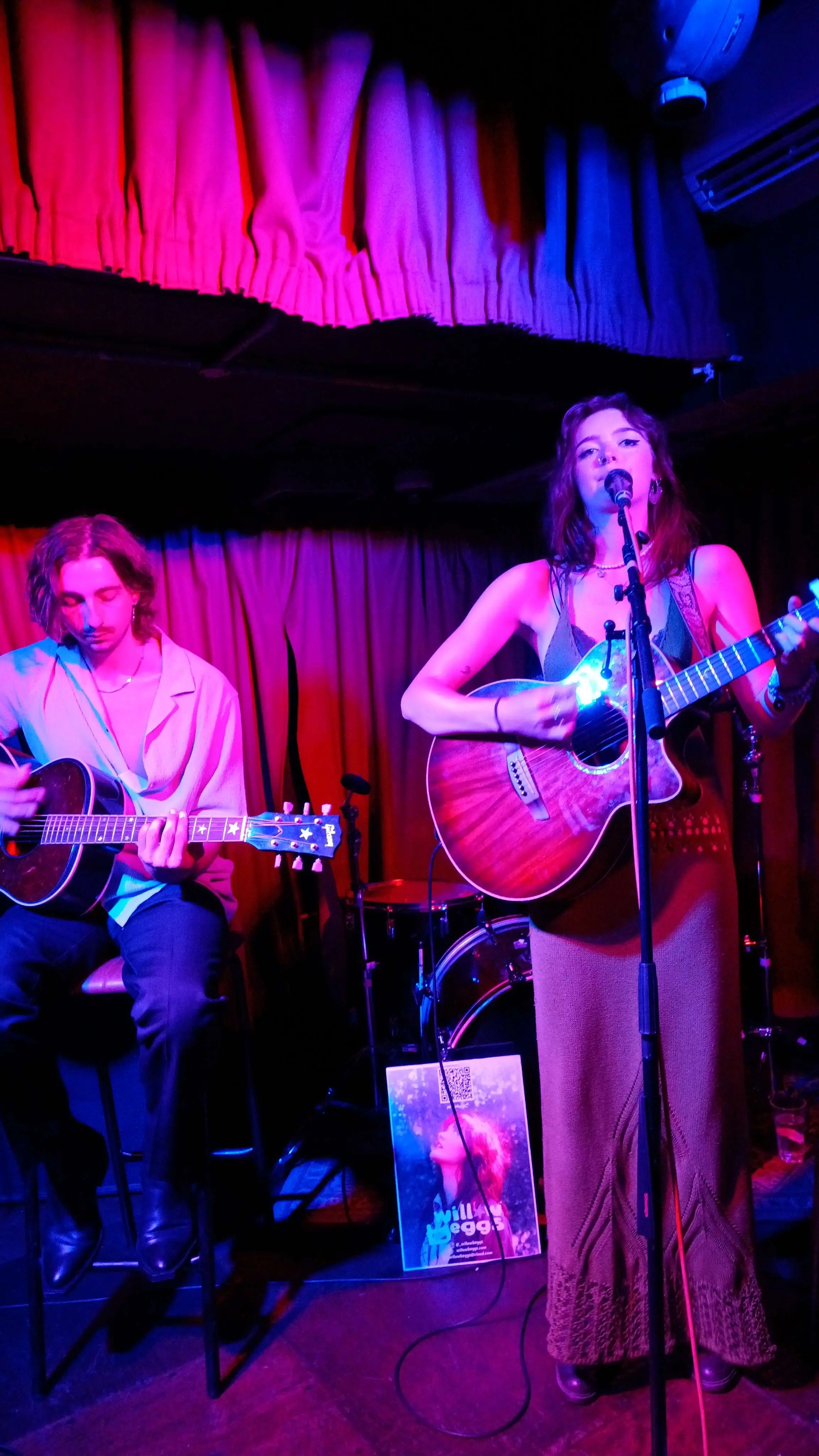 singing and performing in neon lighting