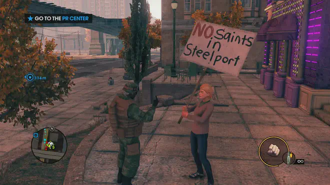 Saints Row 3 screenshot - The boss in an Army uniform gives the middle finger to a protester carrying a banner reading “Saints out of Steelport!”