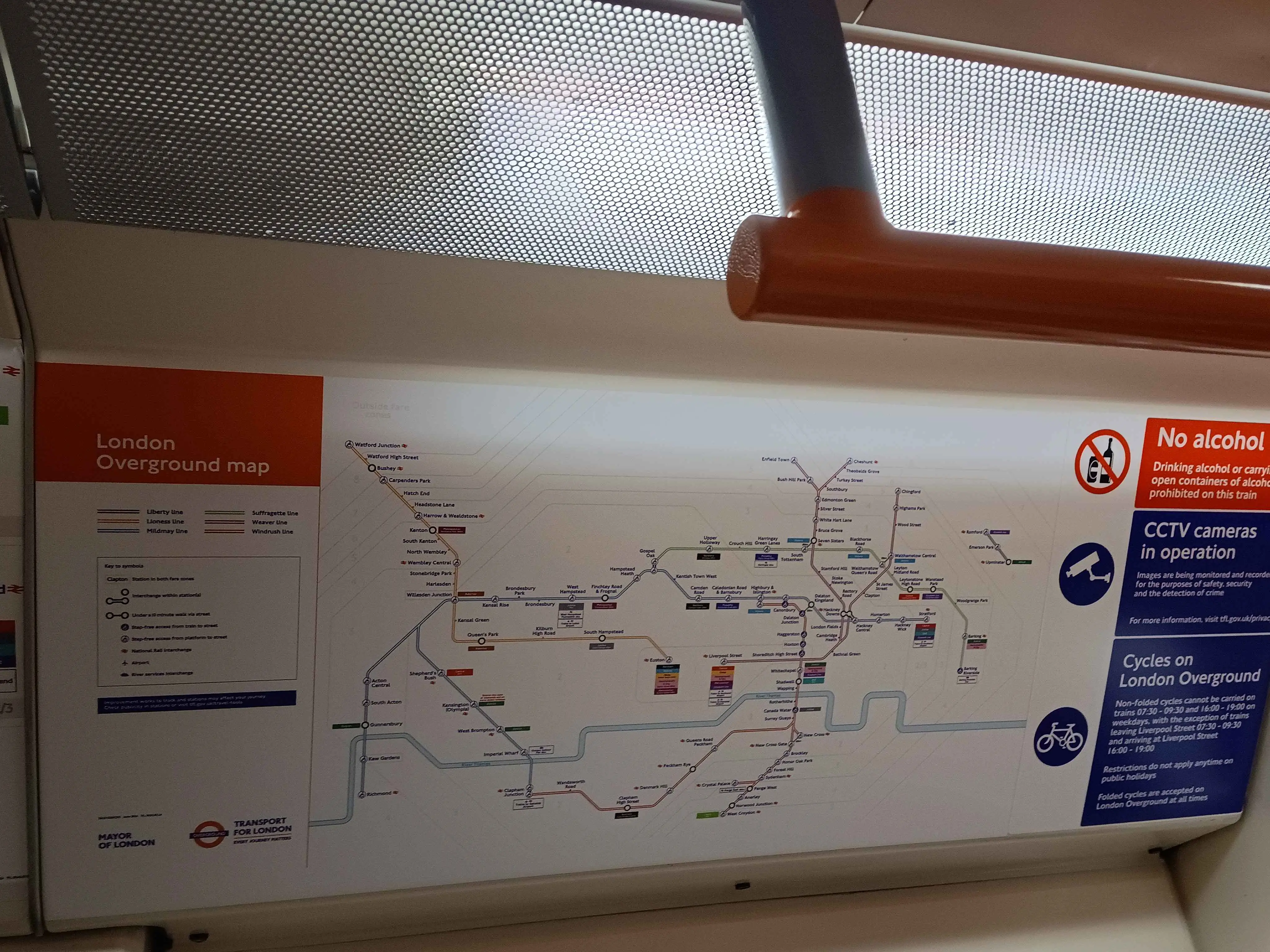 Train line maps inside of a train.