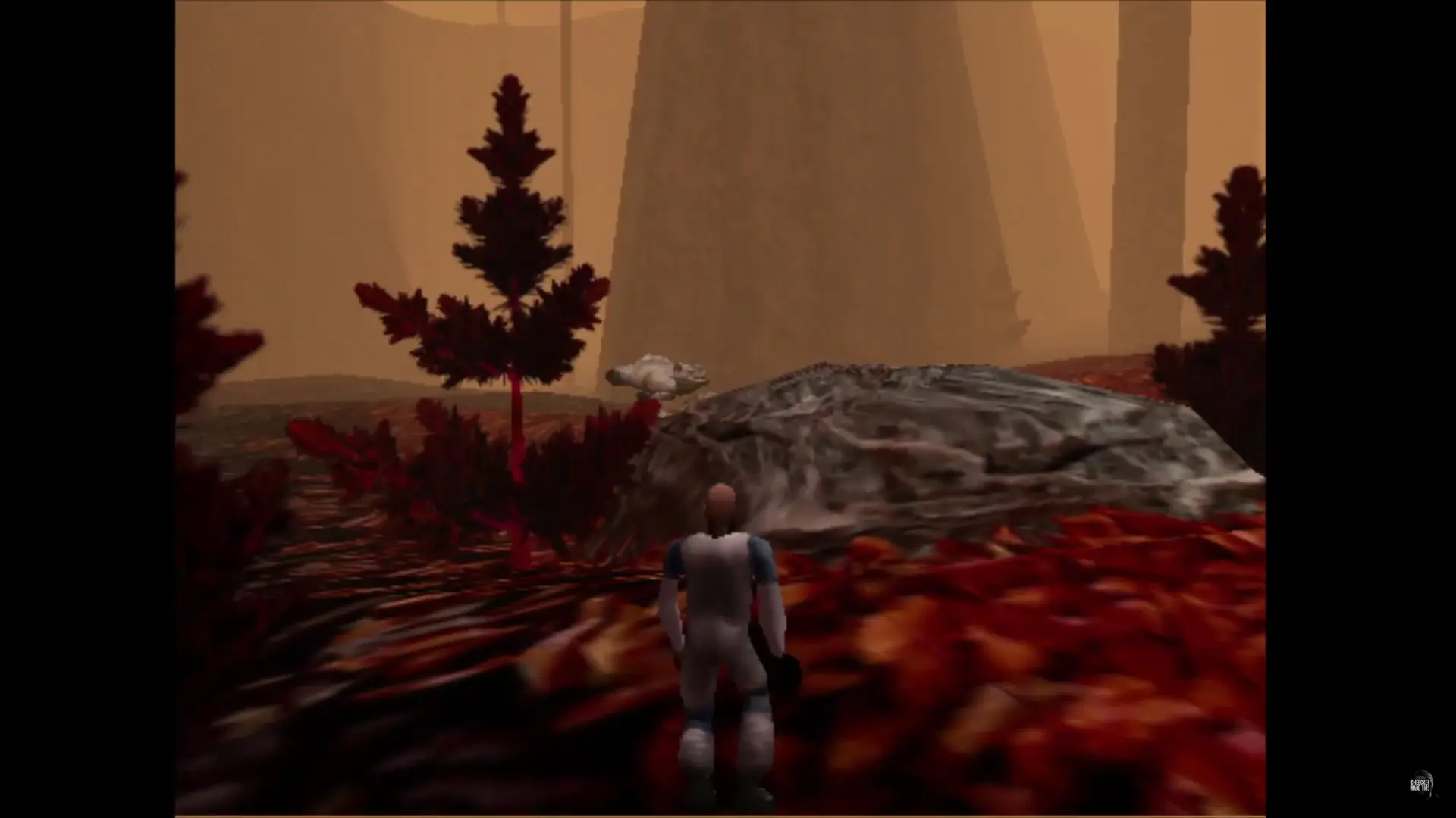 hiding behind a rock, the player spies on a Chomp